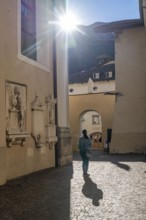 The village of Kaltern, on the South Tyrolean Wine Route, alleyway by the church Parrocchia Maria