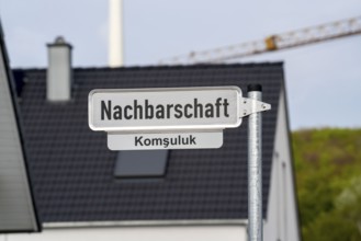 Street sign, neighbourhood, in German and Turkish, new residential quarter with 150 plots, on the