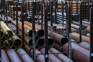 Warehouse for steel pipes in Duisburg harbour, steel pipes in various diameters, North