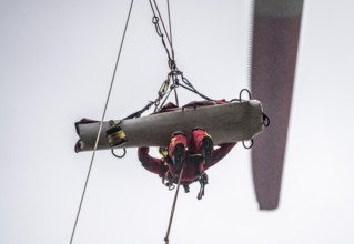 Height rescuers from the Oberhausen professional fire brigade practise abseiling from a wind