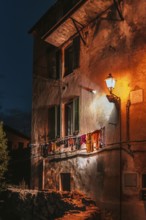 Dilapidated house wall with clothesline, house, evening mood, evening, urban, atmospheric, light,