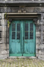 Old dilapidated turquoise-coloured door, wood, wooden door, paint, peeled off, green, entrance door