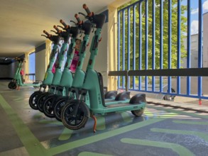 E-scooters in TIER bike hire, designated collection point, multi-storey car park, Bad Cannstatt,