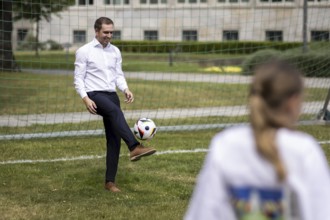 Philipp Lahm, former German football player, photographed playing football during the presentation