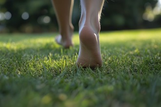 Close up of person's bare feet walking over grass. Generative Ai, AI generated