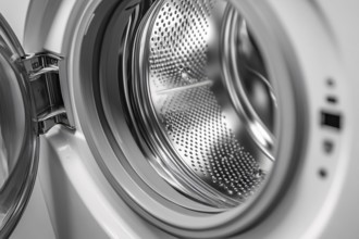 Close up of empty white washing machine of open door. Generative Ai, AI generated