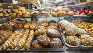 Food, baked goods, many different sweet baked goods and pastries, in a bakery, AI generated, AI