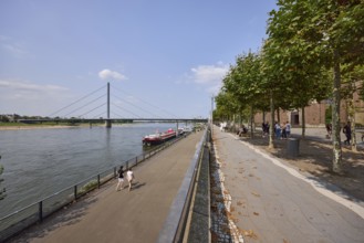 Riverside promenade with Rhine and Rhine knee bridge in Düsseldorf, state capital, independent