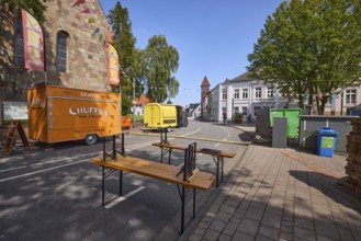 Castle square with snack carts and beer tent sets for the 900th anniversary celebration of the town