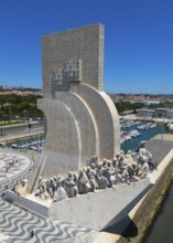 Riverside monument with several statues under a clear sky in an urban environment on a summer day,