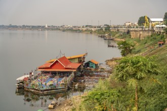 Floating restaurant on the Mekong and the banks of the Mekong in Nong Khai, Thailand, Asia