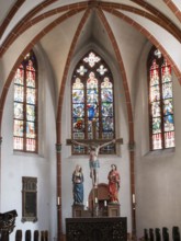 Altar with crucifixion group under the cross vault of St Michael's parish church, Bernkastel,