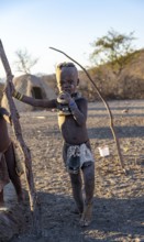 Himba child, in the morning light, traditional Himba village, Kaokoveld, Kunene, Namibia, Africa