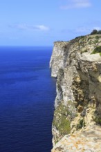 Coastal clifftop landscape view westwards at Ta' Cenc cliffs, island of Gozo, Malta, Europe