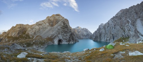 Wild camping, camping in the wilderness with a tent in front of mountain lake Kol Suu, Sary Beles