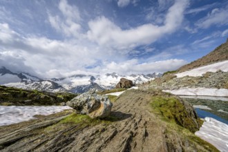 Picturesque mountain landscape at Schwarzsee, mountain peaks with snow and glacier