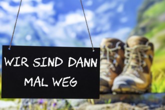 Symbolic image company holidays: Sign with the inscription WIR SIND DANN MAL WEG in front of an