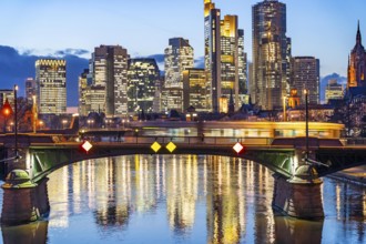 Skyline of the city centre of Frankfurt am Main, river Main, dusk, Ignatz-Bubis-Brücke, tram,