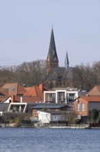 Town view at Lake Malchow with town church, Malchow, island town, Mecklenburg Lake District,