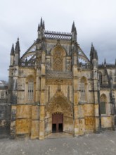 Impressive Gothic cathedral with richly decorated lancet windows and rich details on the