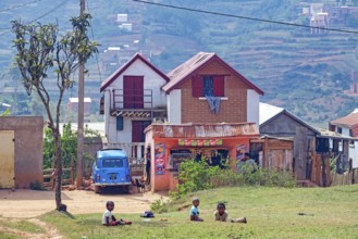 Small grocery shop and two stories brick houses in Betsileo rural village in the Ambositra