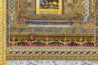 Wat Phra Kaeo temple, royal palace. Royal chapel with Buddhist monks and novices. Bangkok,