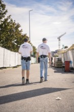 Two security guards at work with urban background, Malleparty Böblingen, Germany, Europe