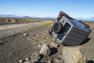 Crashed car, lying on its side, road 864 connecting ring road no.1 with eastern side of Dettifoss