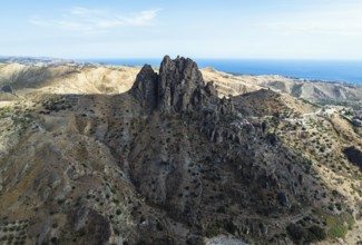 Mountains and Olive groves around Ghost Town from a drone, Pentedattilo Village, Calabria, Italy,