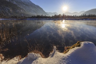 Mountains reflected in lake, evening light, sunbeams, snow, winter, seven springs, behind