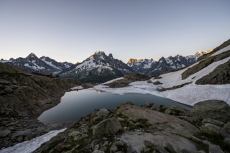 Mountain lake in the morning, mountain landscape at sunrise, water reflection in Lac Blanc,