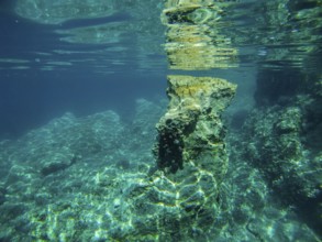 Clear underwater picture with rocks and water reflections in the sea, Lastovo, Neretva, Croatia,