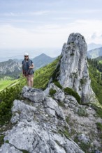 Climber with climbing rope on a climbing tour, climber on a mountain ridge, alpine climbing,