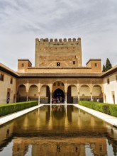 Myrtle courtyard with water basin and Torre de Comares, arabesque Moorish architecture, Nasrid