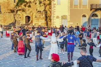 Group of people performing traditional Greek dance, Chania, Crete, Greek Islands, Greece, Europe