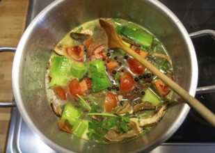 Vegetable soup, or vegetable stock, is cooked with various vegetables, which are slowly simmered