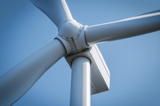 Close up of center of wind mill turbine in front of blue sky. Generative Ai, AI generated