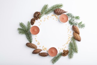 Christmas or New Year wreath composition. Decorations, cones, candles, fir and spruce branches, on