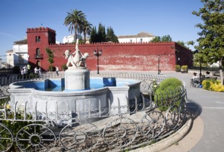 Moorish red castle walls in Plaza de la Constitucion, Alhama de Granada, Spain, Europe