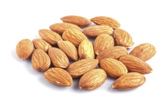 Pile of almonds isolated on white background. close up