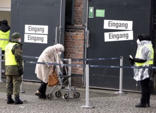 An elderly woman arriving at the vaccination centre in the Arena in Treptow, Berlin, 09.02.2021