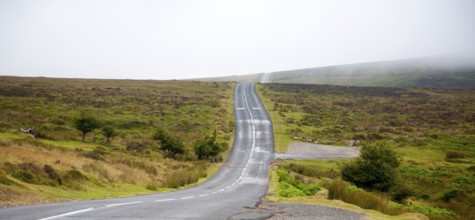 Empty road crossing moorland near Postbridge, Dartmoor national park, Devon, England, UK