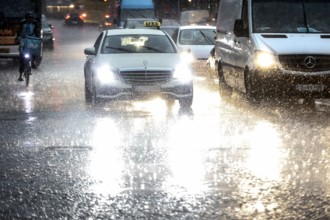 Heavy rain on Potsdamer Strasse. After weeks of heat, the first heavy rain and cooling brought to