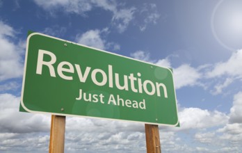 Revolution just ahead green road sign over clouds and blue sky, AI generated