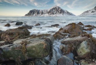 Long exposure, winter evening mood at Skagsanden, stones on the beach at Flakstad, Flakstadøy,