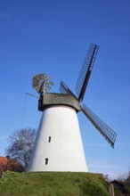 Windmill Hummelbecker Mühle against a cloudless blue sky, a Wall-Holländer, is part of the