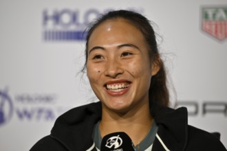 Qinwen Zheng (CHN) portrait, smiles, microphone, mike, logo, WTA, press conference, press