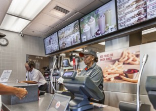 Employee taking a fast food order in a Burger King restaurant