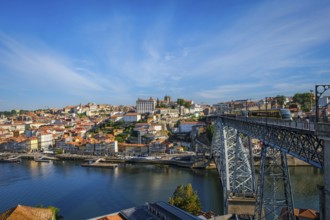 View of Porto city and Douro river and Dom Luis bridge I with metro tram from famous tourist