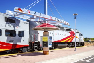 Train of the New Mexico Rail Runner Express regional railway at Zia Road station in Santa Fe, USA,